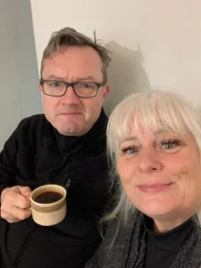 Tom and his wife enjoying a morning coffee on his 60th birthday.