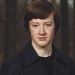 AI-generated illustration of a young man resembling Tom in 1981, standing in a dark forest